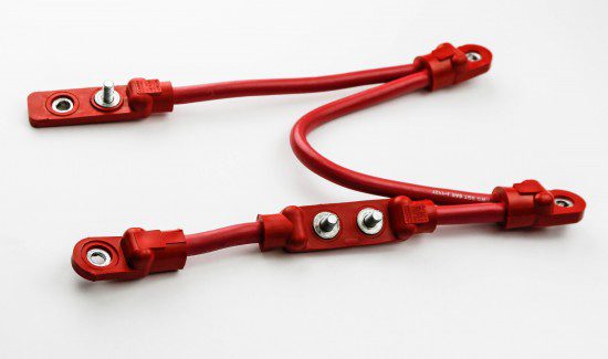 F2A0057-550x325 a white background with two red cords hanging from the top left corner to the bottom right corner