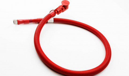 F2A0077-550x325 a red hose, possibly a fire hose, lying on a white surface