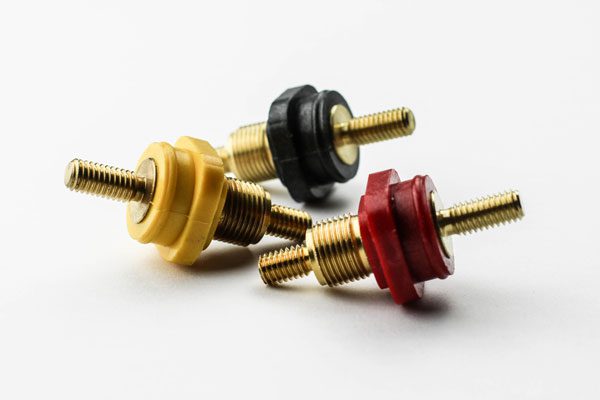 specialty-components-pass-thrus a red hose, possibly a fire hose, lying on a white surface